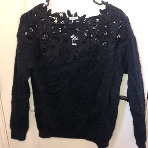 Black sweater with floral eyelet detail